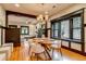 Dining area leading to living room with hardwood floors and lots of light at 3525 N Alcott St, Denver, CO 80211