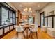 Charming dining area with a window seat and modern chandelier at 3525 N Alcott St, Denver, CO 80211