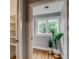 Hallway view with plant and view of trees outside the bright window at 3525 N Alcott St, Denver, CO 80211