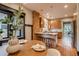 View of open kitchen, island with seating, and stainless appliances at 3525 N Alcott St, Denver, CO 80211