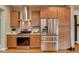 Kitchen featuring stainless steel appliances and wood cabinets at 3525 N Alcott St, Denver, CO 80211