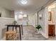 Basement kitchenette with modern cabinets, small table, and adjacent bathroom at 3525 N Alcott St, Denver, CO 80211