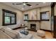 Cozy living room featuring a brick fireplace and comfortable seating area at 3525 N Alcott St, Denver, CO 80211