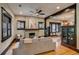 Open living area featuring a brick fireplace and view into the dining area at 3525 N Alcott St, Denver, CO 80211