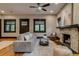 Spacious living room with hardwood floors, fireplace, and comfortable gray sofa at 3525 N Alcott St, Denver, CO 80211