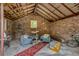 Cozy living room with exposed brick, wood beams, and stylish furnishings, creating a rustic yet inviting atmosphere at 3525 N Alcott St, Denver, CO 80211