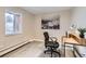 Office featuring a desk, black office chair, and decor at 5491 E Warren Ave # 224, Denver, CO 80222