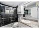 Modern bathroom featuring a glass enclosed shower and granite vanity at 8871 Rutgers St, Westminster, CO 80031