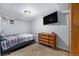 This bedroom features a TV, wood dresser, and window at 8871 Rutgers St, Westminster, CO 80031
