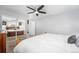 Bright bedroom featuring a ceiling fan and mirrored closet doors at 8871 Rutgers St, Westminster, CO 80031