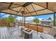 Relaxing deck featuring a fire pit and seating area, perfect for outdoor entertaining at 8871 Rutgers St, Westminster, CO 80031