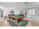 Inviting game room with pool table and comfortable leather couches at 8871 Rutgers St, Westminster, CO 80031