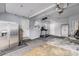 Spacious garage area perfect for storage and hobbies, featuring high ceilings and ample lighting at 8871 Rutgers St, Westminster, CO 80031