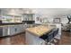 Modern kitchen with stainless steel appliances, granite countertops, and breakfast bar seating at 8871 Rutgers St, Westminster, CO 80031