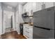 Modern kitchen with stainless steel appliances, white cabinets, and stylish hardware at 8871 Rutgers St, Westminster, CO 80031
