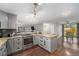 Open kitchen with granite counters, stainless steel appliances, and seamless flow to the dining area at 8871 Rutgers St, Westminster, CO 80031