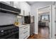 A contemporary kitchen featuring stainless steel appliances, granite counters, and white cabinetry at 8871 Rutgers St, Westminster, CO 80031