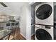 Convenient, stacked washer and dryer in dedicated space with shelf at 8871 Rutgers St, Westminster, CO 80031