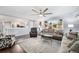 Bright living room featuring stylish furnishings and a large window, open to the kitchen at 8871 Rutgers St, Westminster, CO 80031