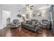 An open-concept living room and dining room is furnished with couches, chairs, and tables at 8871 Rutgers St, Westminster, CO 80031