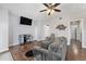 This living room features hardwood floors, furniture, a fan, and a television at 8871 Rutgers St, Westminster, CO 80031