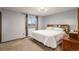 Main bedroom with a king-size bed and ample natural light at 2652 S Sable Way, Aurora, CO 80014