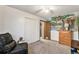 Bedroom with mural, closet, and seating at 2652 S Sable Way, Aurora, CO 80014