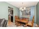 Classic dining room with a wood table and chairs, offering kitchen views at 2652 S Sable Way, Aurora, CO 80014