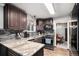Modern kitchen with granite countertops and stainless steel appliances at 2652 S Sable Way, Aurora, CO 80014