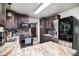 Modern kitchen features granite countertops and stainless steel appliances at 2652 S Sable Way, Aurora, CO 80014