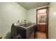 Laundry room with washer, dryer, and access to an updated bathroom at 2652 S Sable Way, Aurora, CO 80014
