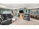 Open living room with sectional sofa and access to dining area at 2652 S Sable Way, Aurora, CO 80014