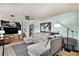 Spacious living room featuring a large sectional sofa and a flat-screen TV at 2652 S Sable Way, Aurora, CO 80014