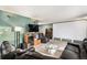 Spacious living room with a large sectional sofa and projection screen at 2652 S Sable Way, Aurora, CO 80014