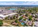 This is a bird's eye view of neighborhood homes and nearby businesses with a body of water in the distance at 3145 W Farmdale Rd, Englewood, CO 80110