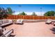 Outdoor area with gravel, featuring multiple seating areas, creating a relaxing and social backyard space at 3145 W Farmdale Rd, Englewood, CO 80110