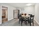 Basement kitchenette with stainless steel fridge and table creating a functional and inviting space at 3145 W Farmdale Rd, Englewood, CO 80110