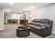 Finished basement features comfortable seating and an adjacent dining area, perfect for entertaining at 3145 W Farmdale Rd, Englewood, CO 80110