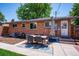 Inviting outdoor dining space with a table, chairs, and a decorative rug on a spacious backyard patio at 3145 W Farmdale Rd, Englewood, CO 80110