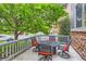Inviting front porch with outdoor seating and table, offering a relaxing outdoor space at 12125 Helena St, Brighton, CO 80603