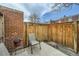 Private backyard patio area with brick accents and space for outdoor seating at 710 E Alameda Ave, Denver, CO 80209