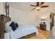Relaxing bedroom with hardwood floors, ceiling fan, and natural light at 710 E Alameda Ave, Denver, CO 80209