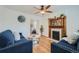 Inviting living room with hardwood floors, fireplace, and comfortable blue seating at 710 E Alameda Ave, Denver, CO 80209