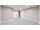 Finished basement featuring neutral paint, recessed lighting, gray carpet and stairs at 9255 Melborne Ct, Parker, CO 80134