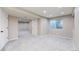 Finished basement featuring neutral paint, recessed lighting, gray carpet and large window at 9255 Melborne Ct, Parker, CO 80134