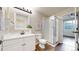 Bright bathroom featuring a white vanity and glass shower, creating a clean and modern space at 9255 Melborne Ct, Parker, CO 80134