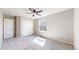 Bedroom featuring neutral walls, plush carpet, and bright natural light from the window at 9255 Melborne Ct, Parker, CO 80134