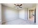 Bedroom featuring neutral walls, carpet, closet, and a view into an en-suite bathroom at 9255 Melborne Ct, Parker, CO 80134