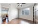 Comfortable bedroom features a ceiling fan, closet, and a window at 9255 Melborne Ct, Parker, CO 80134
