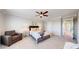 Spacious bedroom with carpet flooring, large window, ceiling fan and a warm and inviting atmosphere at 9255 Melborne Ct, Parker, CO 80134